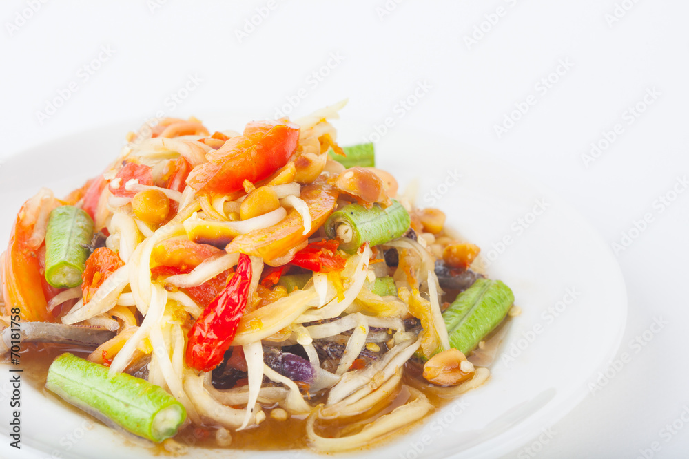 papaya salad on dish with white paper background papaya salad on dish with white paper background