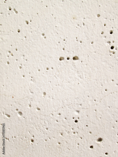 white wall with a hole background