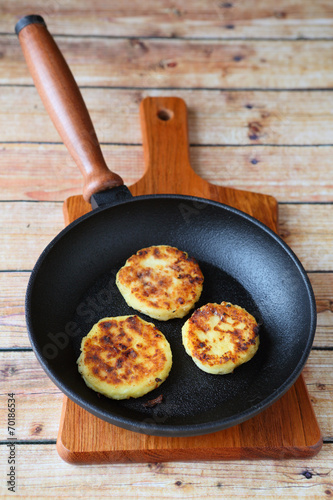 three pancakes in a frying pan