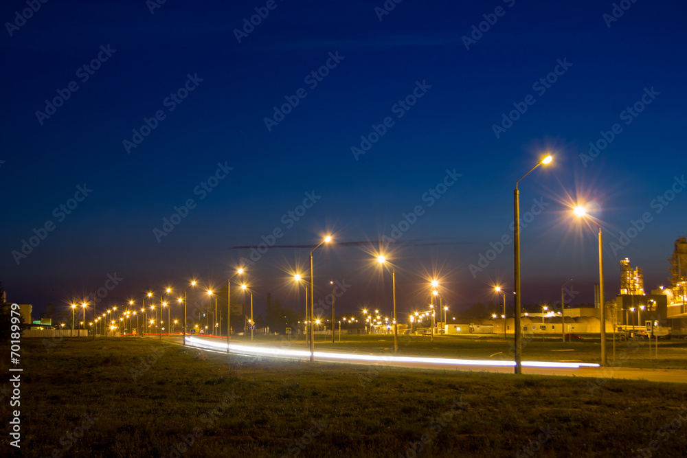 Road near the factory at night. - obrazy, fototapety, plakaty 