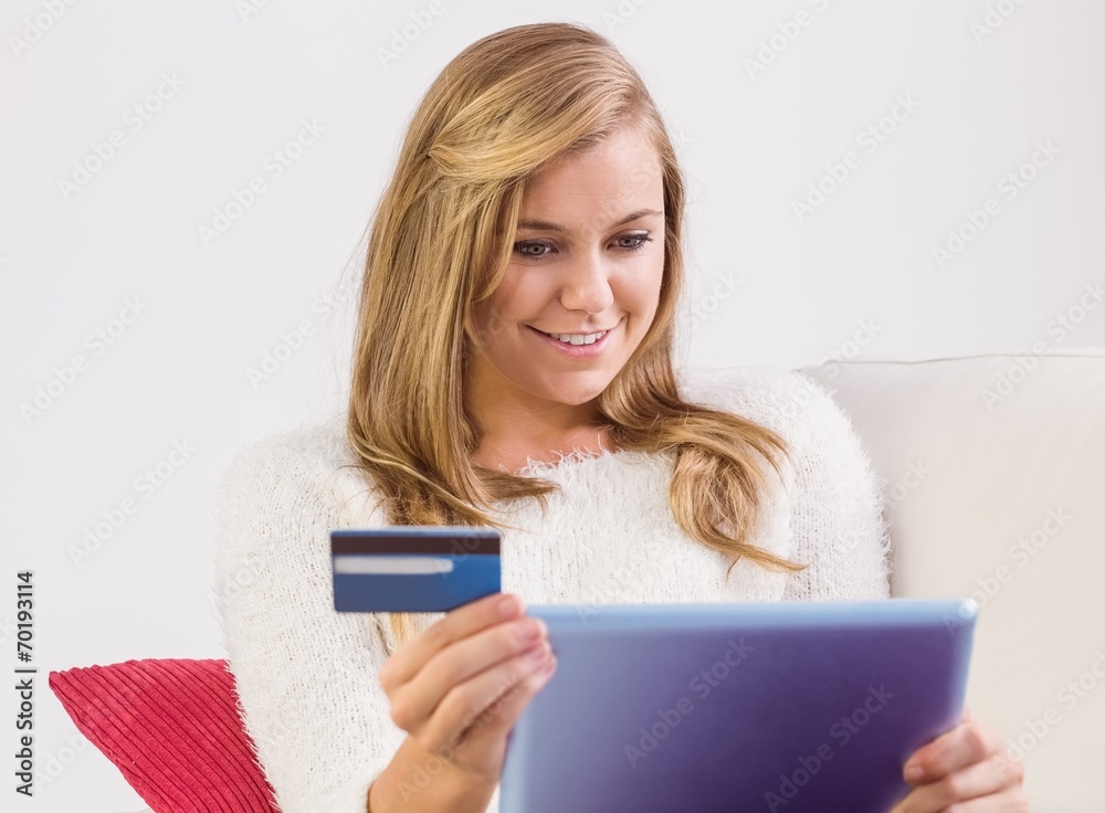 Pretty blonde shopping online with tablet pc Pretty blonde shopping online with tablet pc