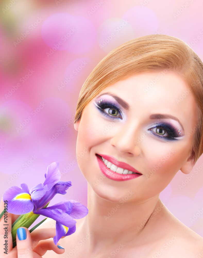 Beautiful young woman with glamour make up and flower Beautiful young woman with glamour make up and flower