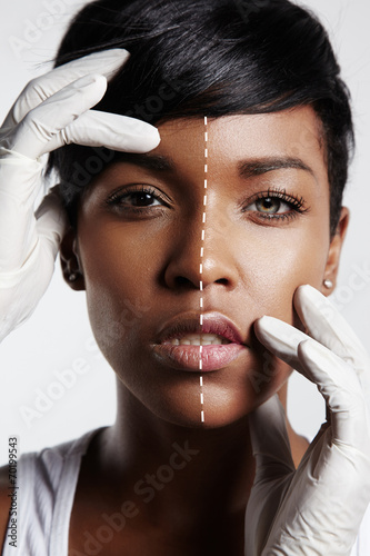 portrait of a black woman with a half of a face with a whitening photo