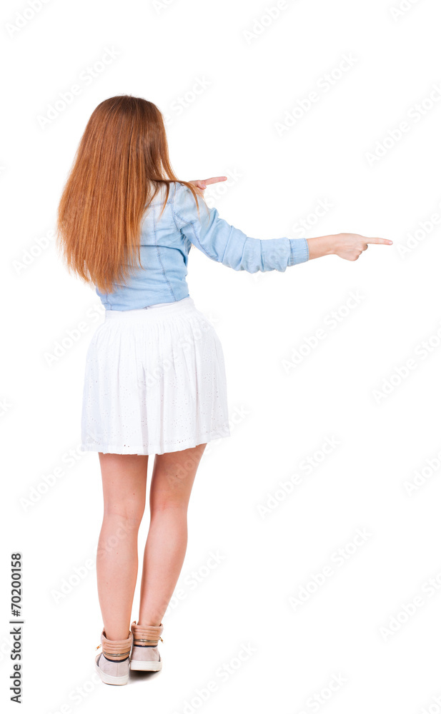 Back view of pointing woman. Back view of pointing woman.