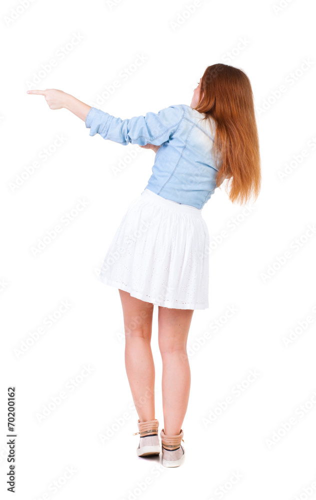 Back view of  pointing woman.