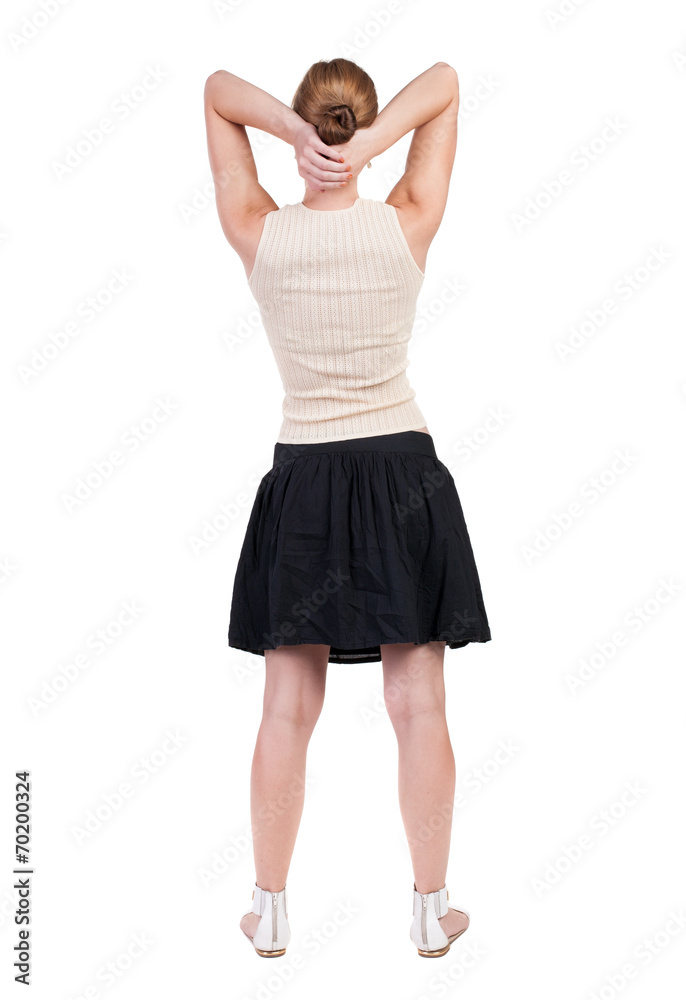 Fototapeta premium back view of standing young beautiful woman.