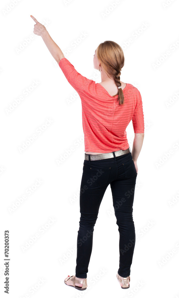 Back view of pointing woman. Back view of pointing woman.