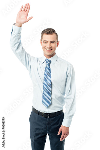 Business execuitve raising his hand