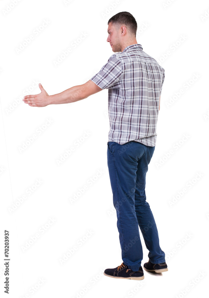Back side view of man in shirt handshake. Back side view of man in shirt handshake.