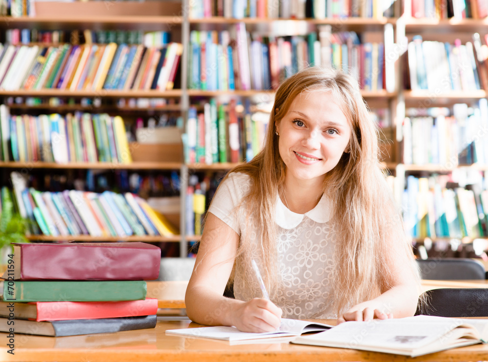 Portrait of a student girl studying at library Portrait of a student girl studying at library