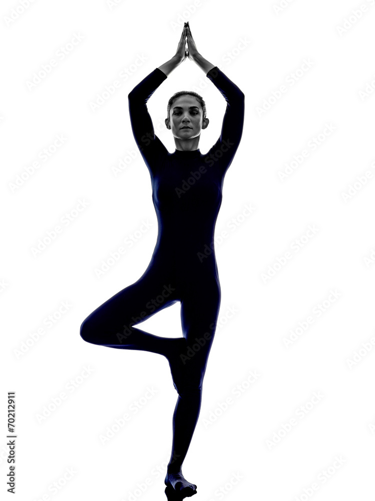 woman exercising Vrksasana tree pose yoga silhouette woman exercising Vrksasana tree pose yoga silhouette