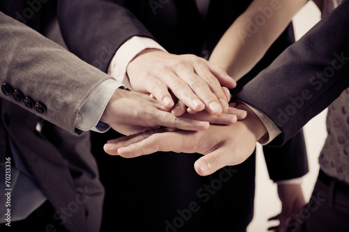 Business group with hands together - teamwork concepts