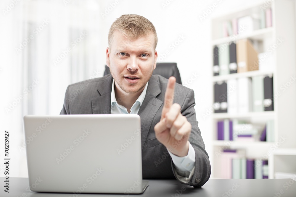 Businessman delivering a lecture to a client Businessman delivering a lecture to a client