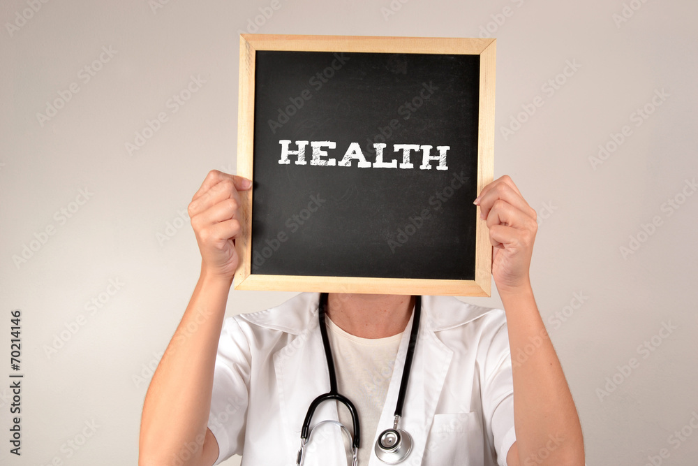 doctor with a blackboard in front of face doctor with a blackboard in front of face