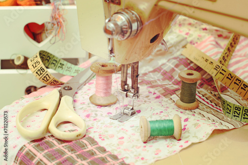 sewing machine  dressmaker scissors and thread-style retro