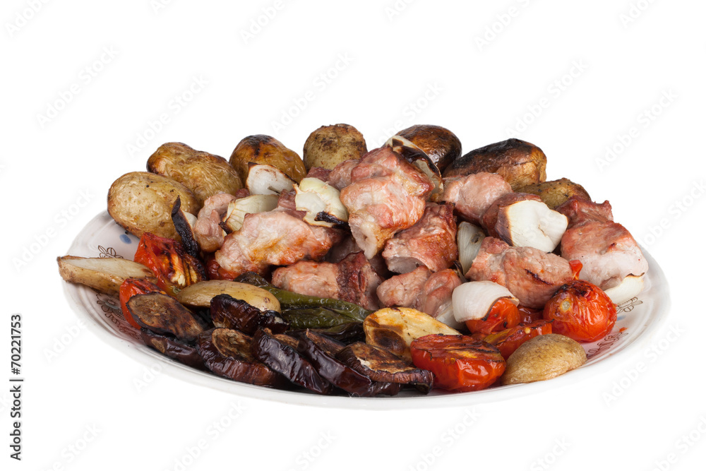 kebab and grilled vegetables on a plate isolated on white backgr kebab and grilled vegetables on a plate isolated on white backgr