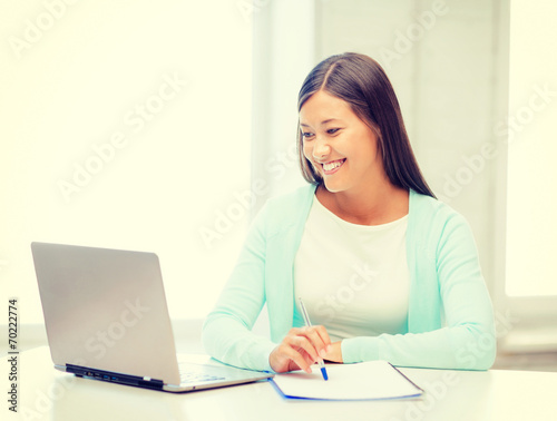 asian businesswoman with laptop and documents