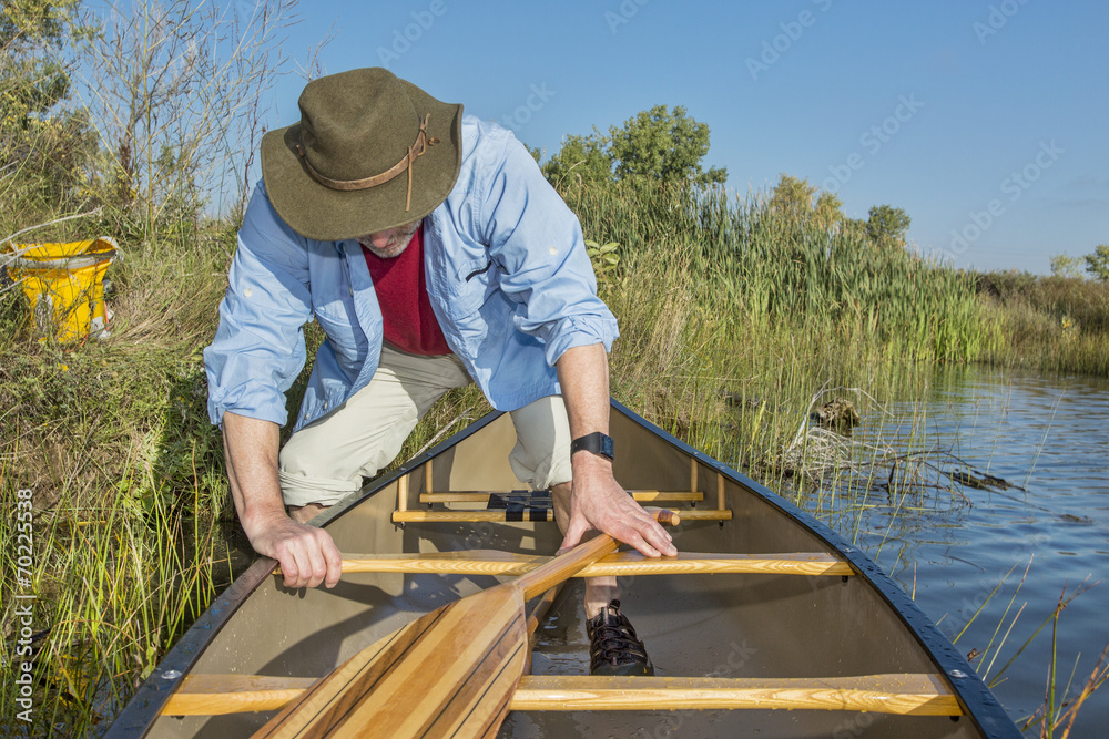 canoe launching on a lake canoe launching on a lake