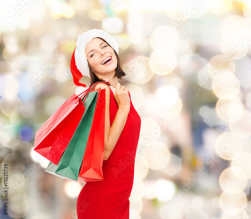 woman in red dress with shopping bags