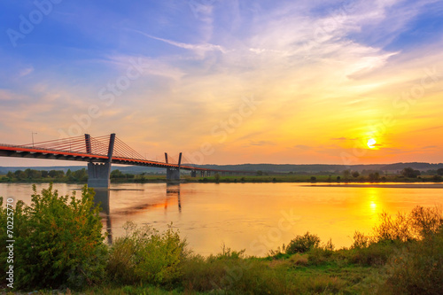Cable stayed bridge over Vistula river in Poland at sunset.