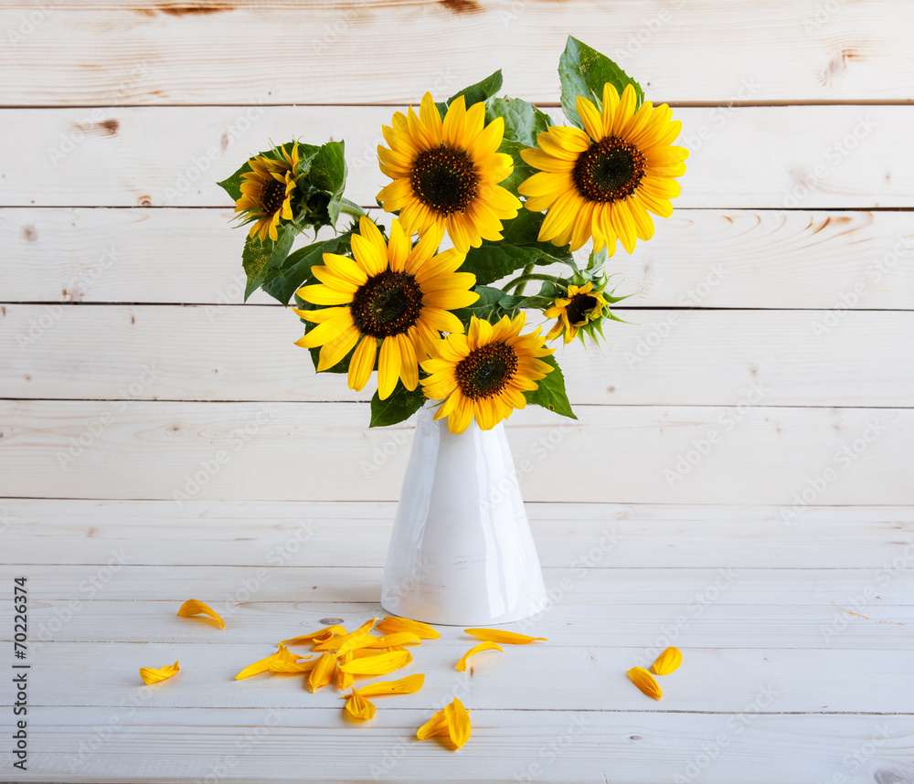 Sunflowers in a vase on a rustic, gray background Stock Photo | Adobe Stock