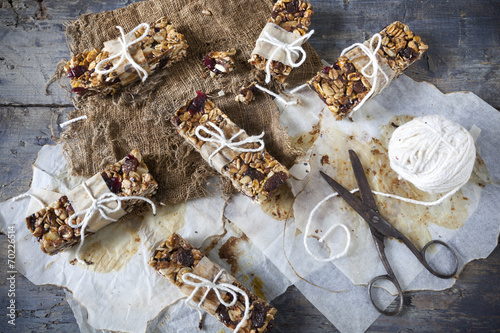 homemade rustic granola bars on vintage wooden background
