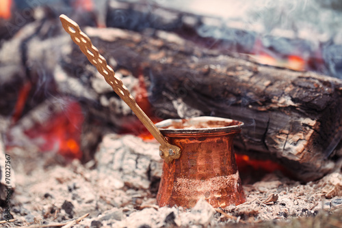 Making coffee in the fireplace on camping or hiking in the natu
