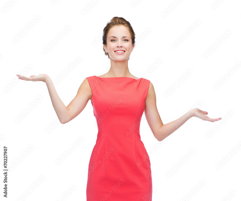 smiling woman holding something imaginary on palms smiling woman holding something imaginary on palms