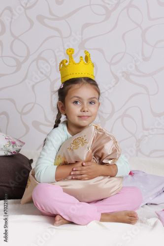 girl in princess crown at pyjamas party © Angel_a
