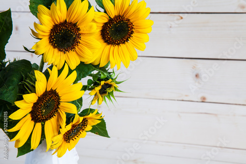 A bouquet of autumn sunflowers in a vase