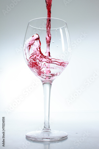 Red wine poured in a glass