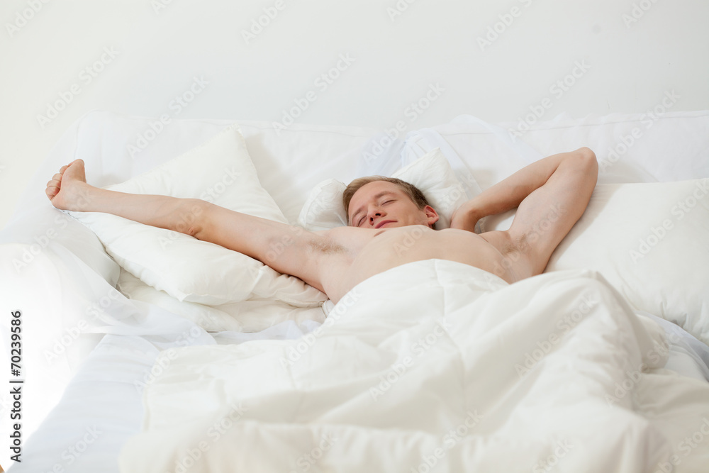 Single man waking up in bed Single man waking up in bed