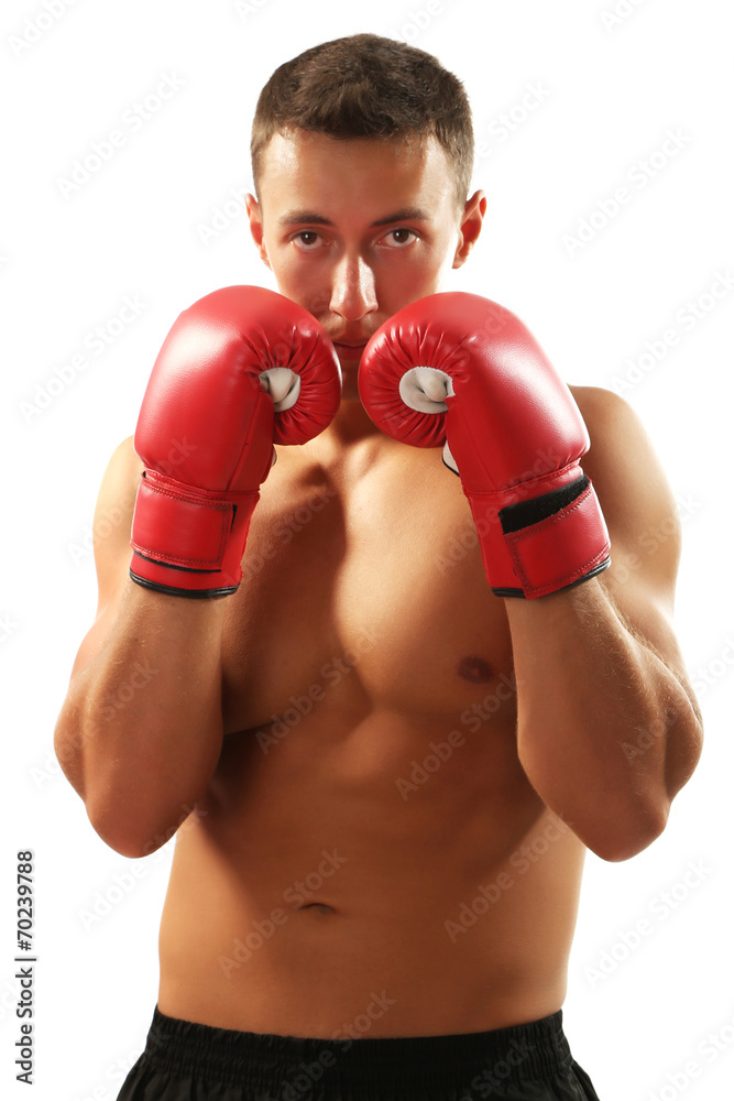 Handsome young muscular sportsman with boxing gloves isolated