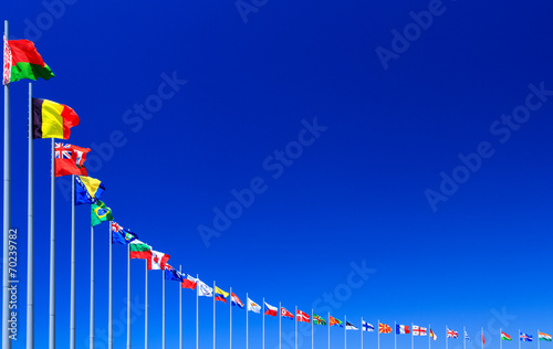 Εκτύπωση καμβά Flags against blue sky, copyspace