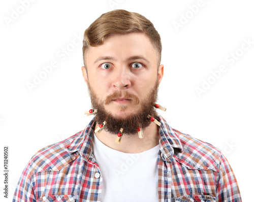 Portrait of handsome man with beard of clothespins isolated