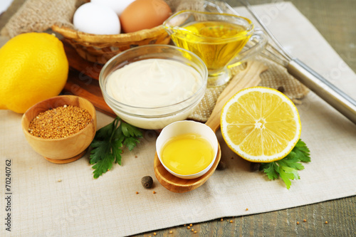 Mayonnaise ingredients on wooden background