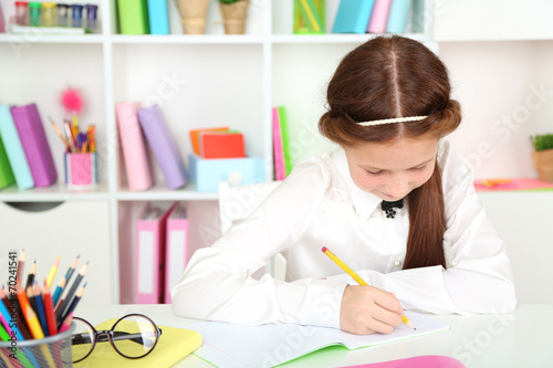 Cute girl at workplace in classroom