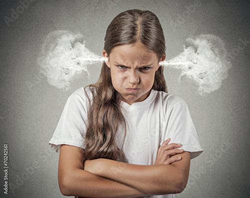 Принти на полотні Angry young girl Blowing Steam from ears grey background