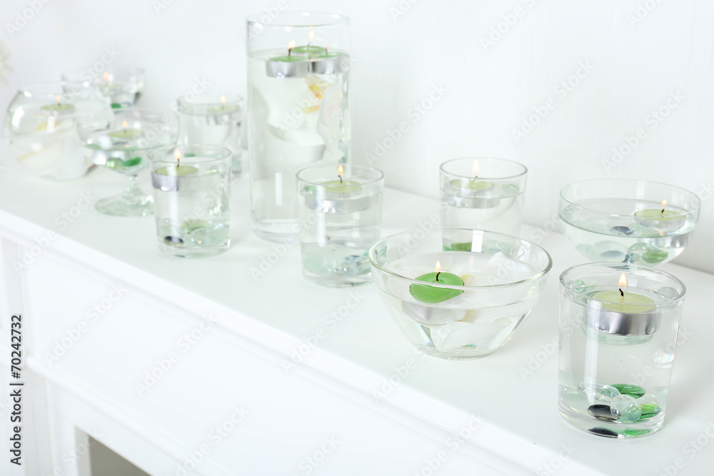 Different objects on white shelf in living room