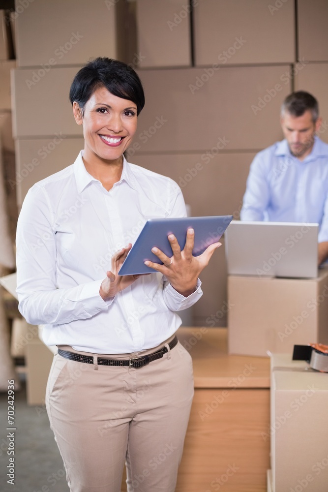 Pretty warehouse manager using tablet pc Pretty warehouse manager using tablet pc
