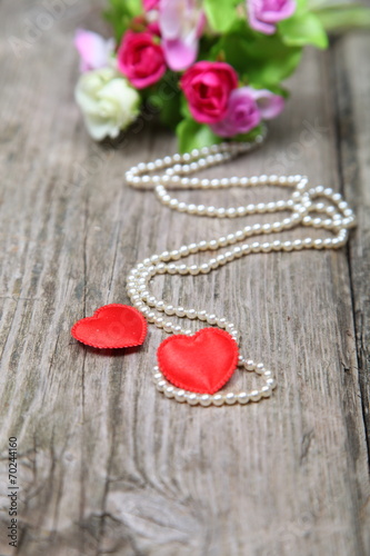 Two red hearts and beads