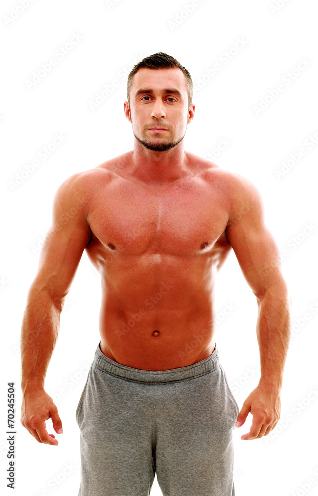 Handsome muscular sportsman standing over white background Handsome muscular sportsman standing over white background
