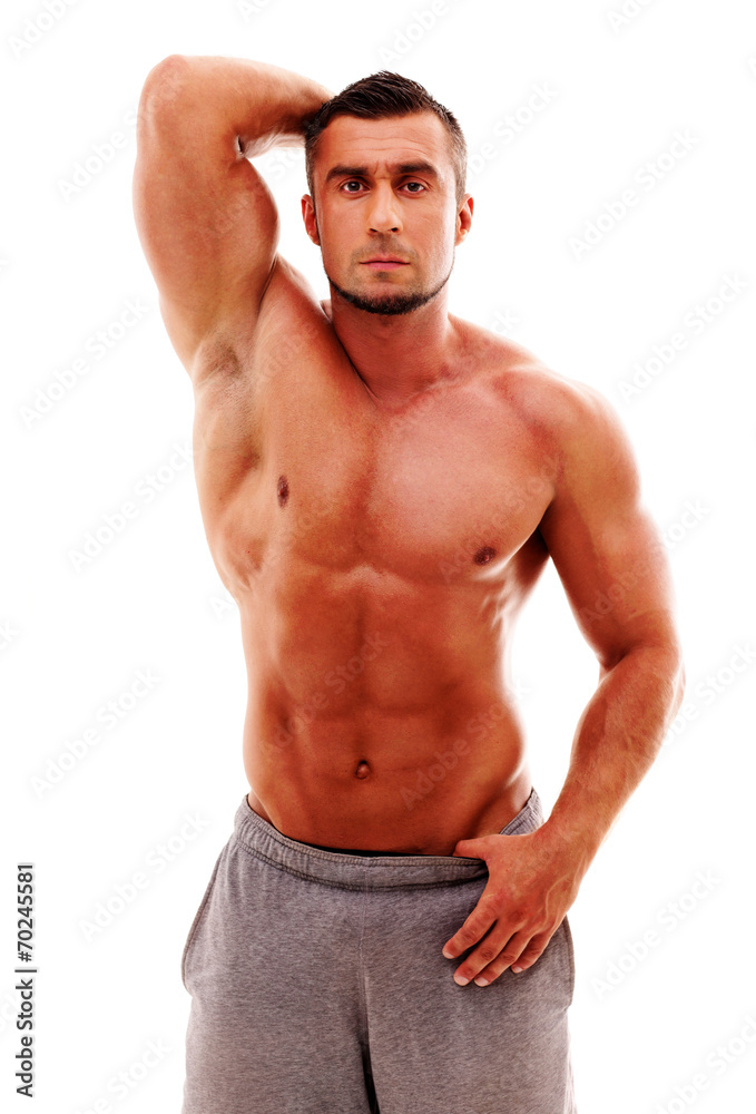 Handsome muscular sportsman over white background Handsome muscular sportsman over white background