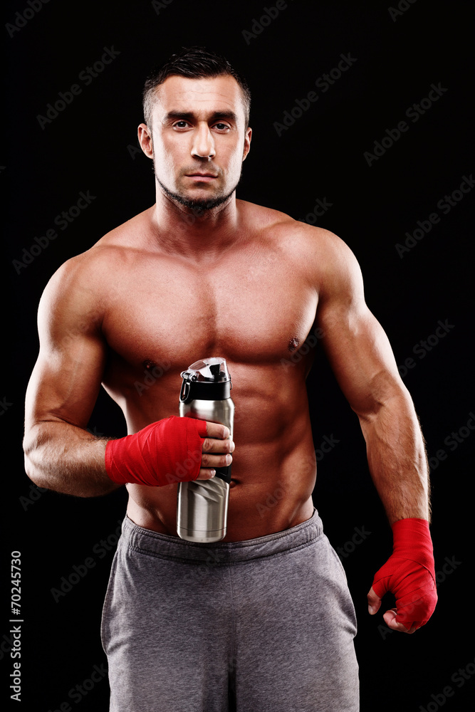 Handsome muscular sportsman isolated