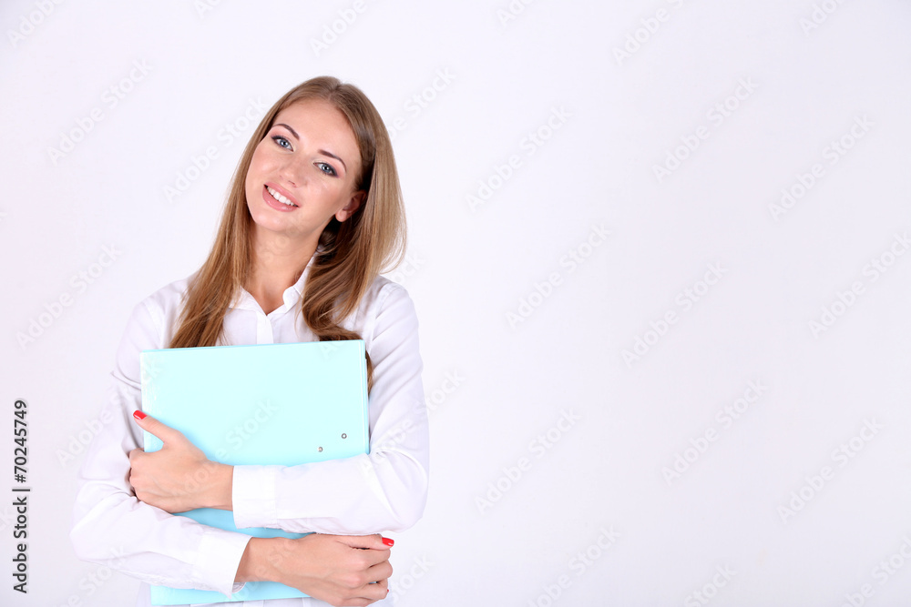 Business woman holding folder, isolated on white Business woman holding folder, isolated on white