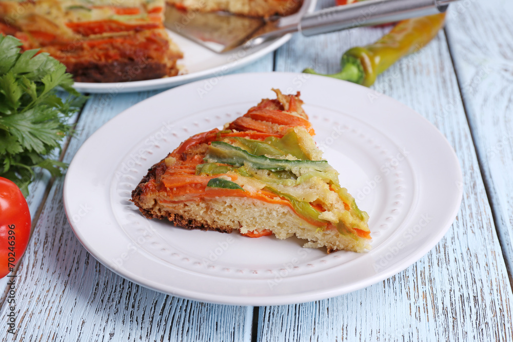 Piece of casserole with vegetables on plate on table close-up Piece of casserole with vegetables on plate on table close-up