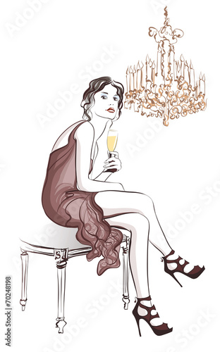 Woman drinking champagne in a stylish decor
