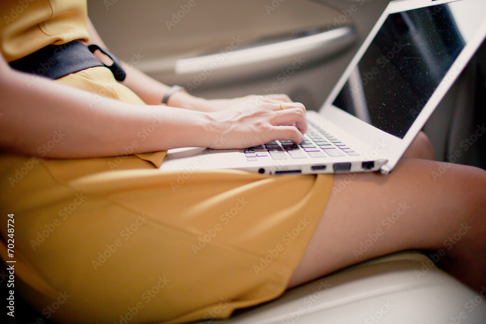 Fototapeta premium businesswoman with document and laptop in car