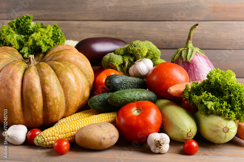 Fresh organic vegetables on wooden background