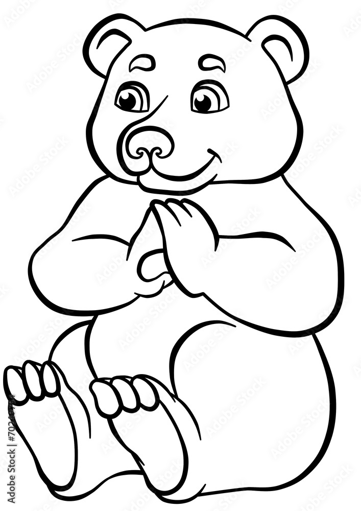 Cute bear sitting and looking at berry in the forest Cute bear sitting and looking at berry in the forest